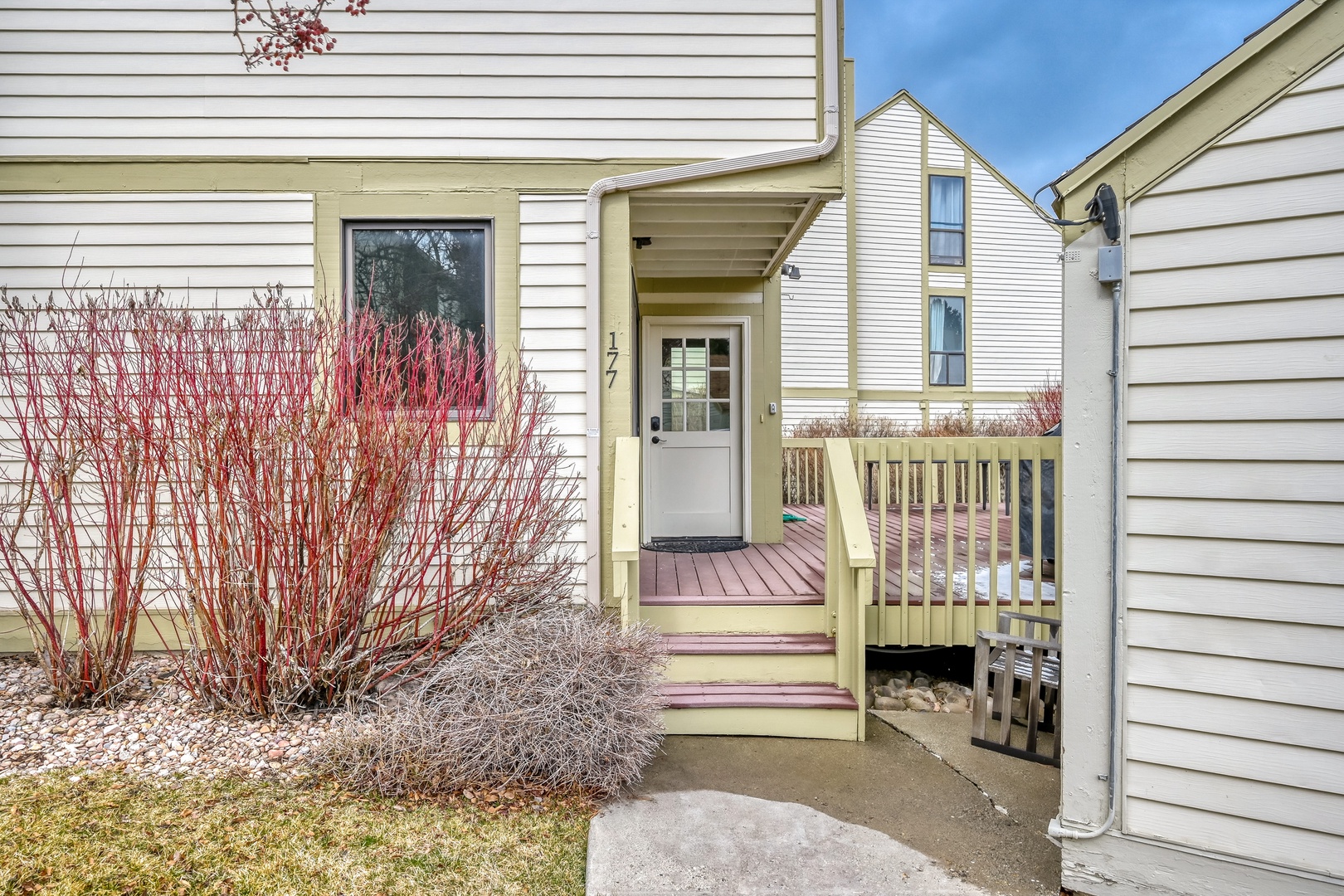 Charming front entrance with welcoming steps leading to your private door, nestled in a quiet residential neighborhood.