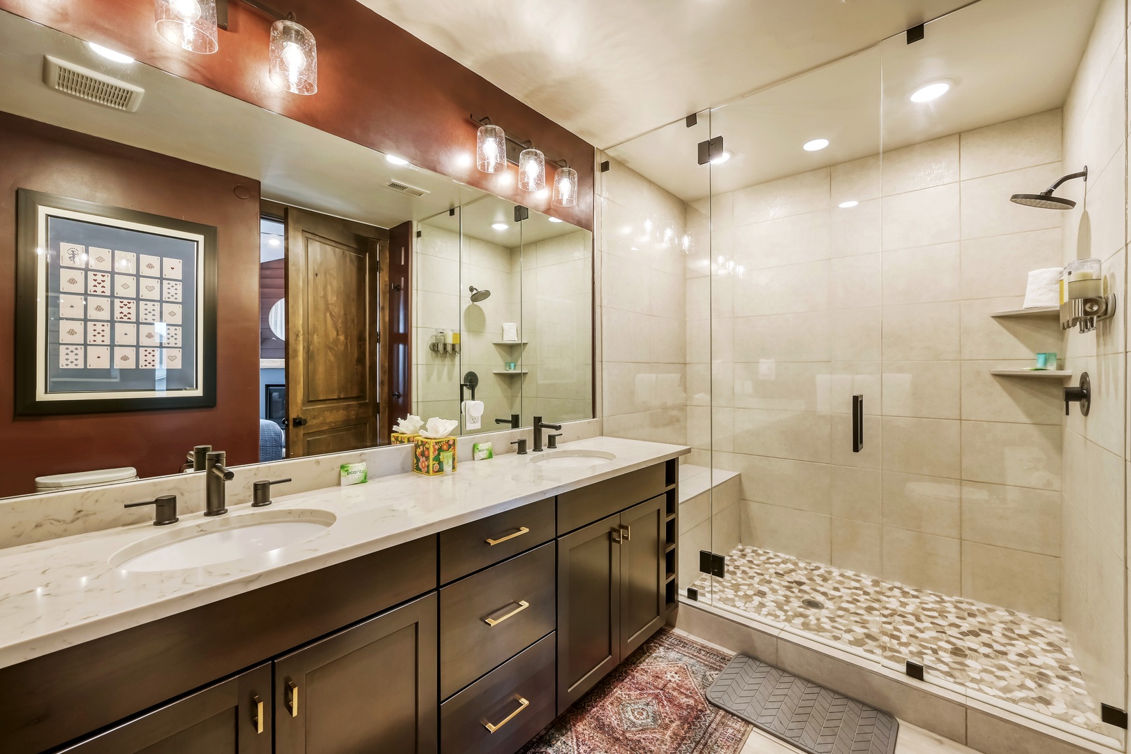 Step into your private spa-like bathroom, where warm modern tones meet elegant marble and a spacious walk-in shower invites you to unwind in comfort.