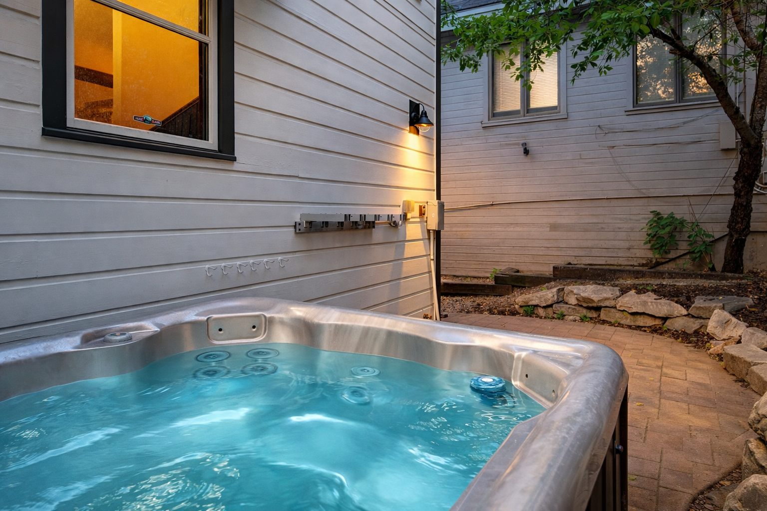 Unwind in the serene backyard oasis featuring a private hot tub, perfect for relaxing under the stars after a day of Park City adventures or ski-in/ski-out fun.