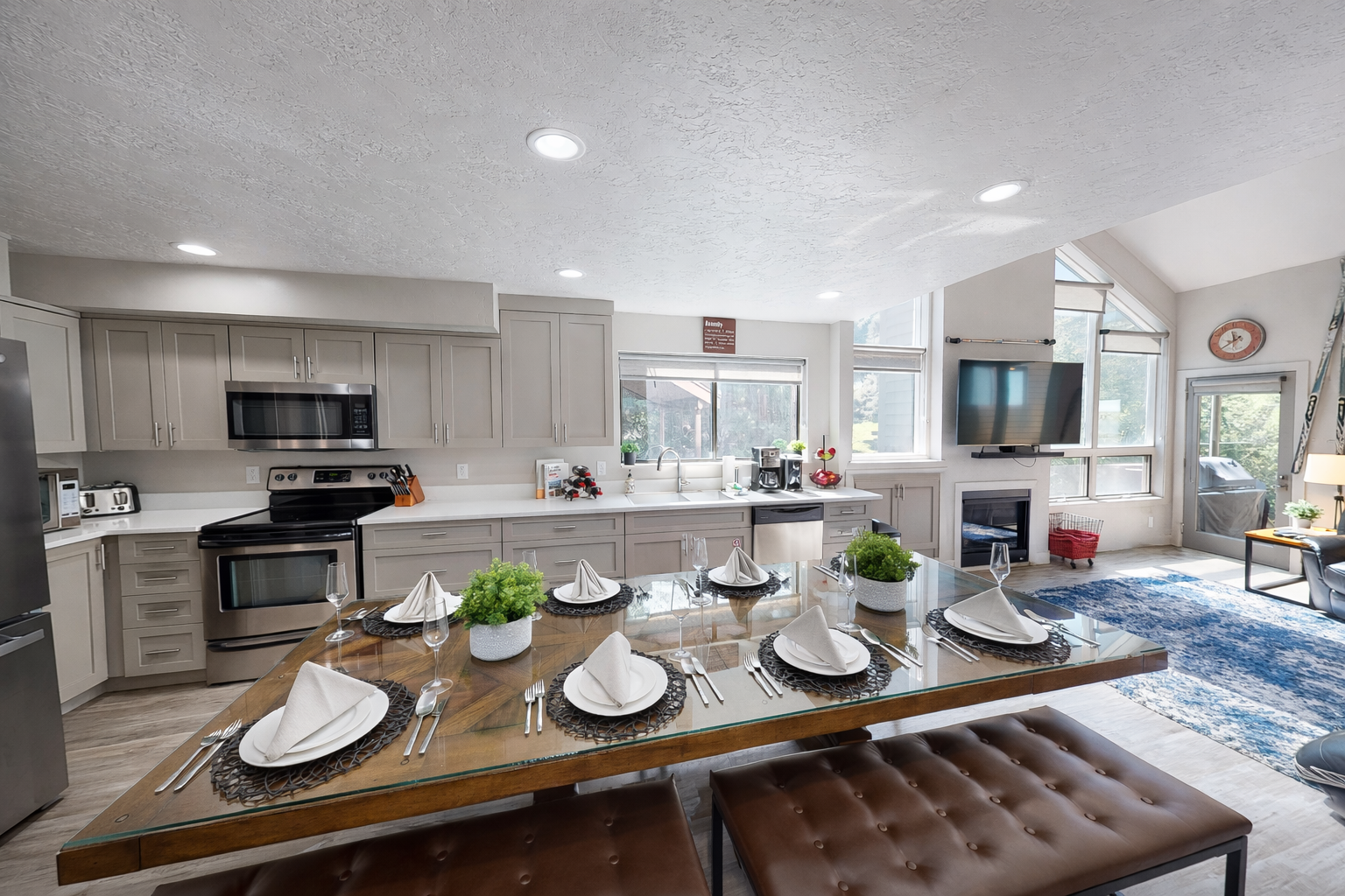 Your spacious kitchen and dining area features modern appliances, elegant table settings, and an open layout perfect for memorable meals together.