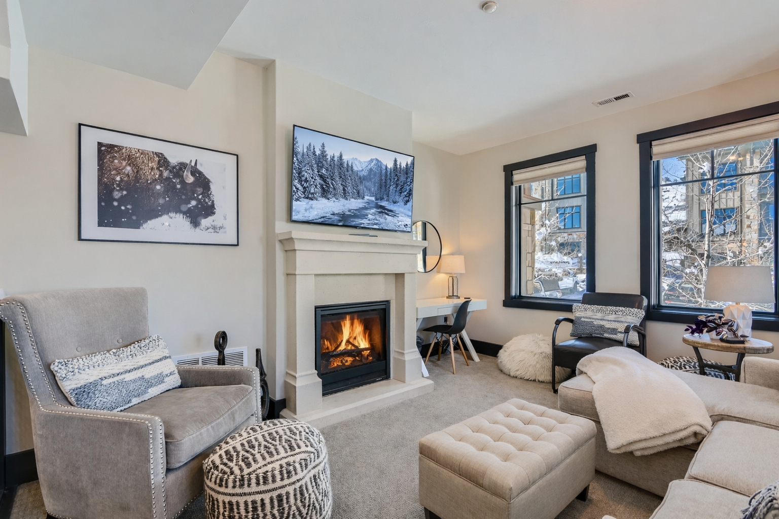 Cozy up by your crackling fireplace while winter views frame your elegant retreat, complete with plush seating and modern comforts.