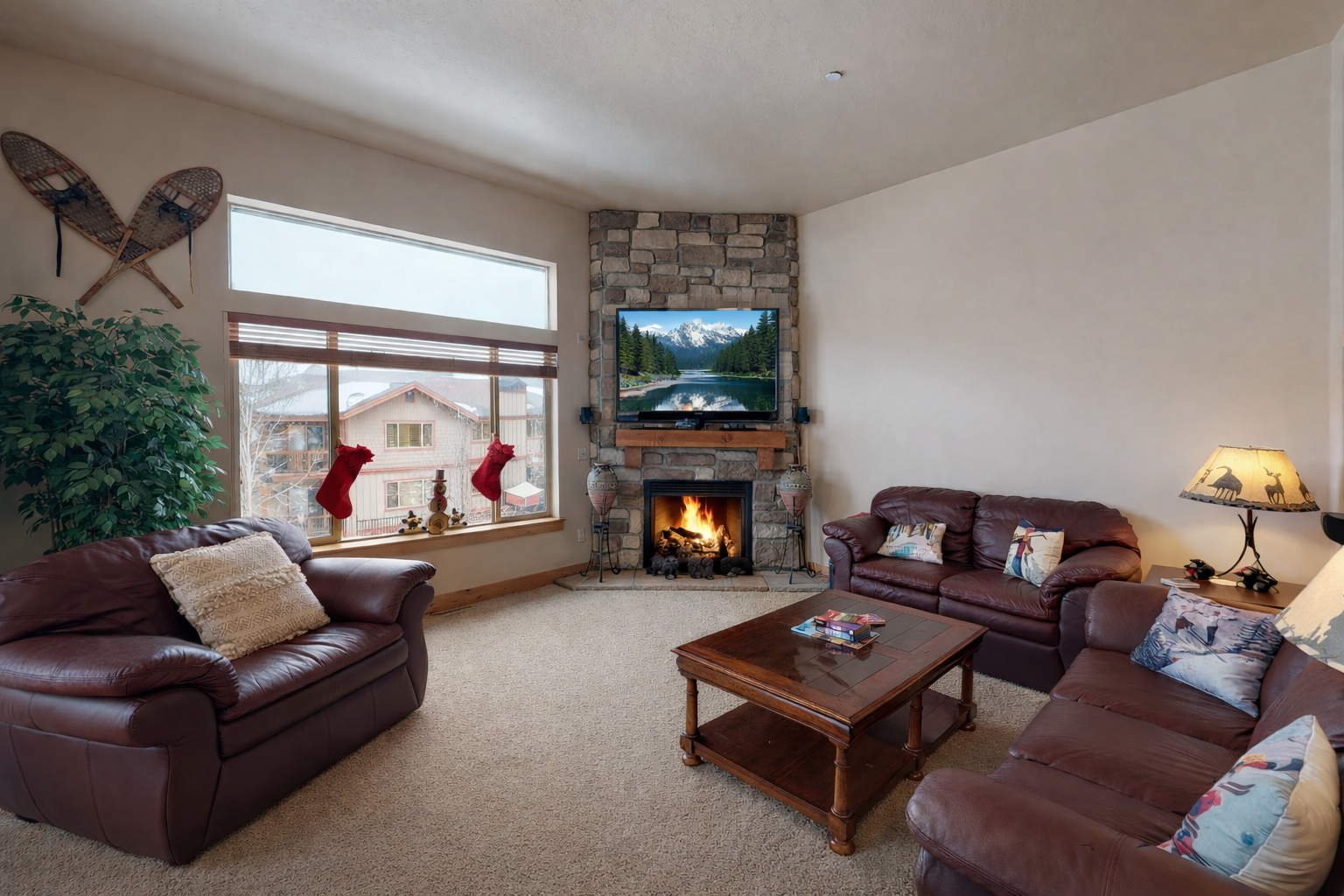 Unwind in this spacious mountain retreat featuring plush leather seating and a cozy stone fireplace. Large windows frame stunning views, making it the perfect year-round Park City escape.
