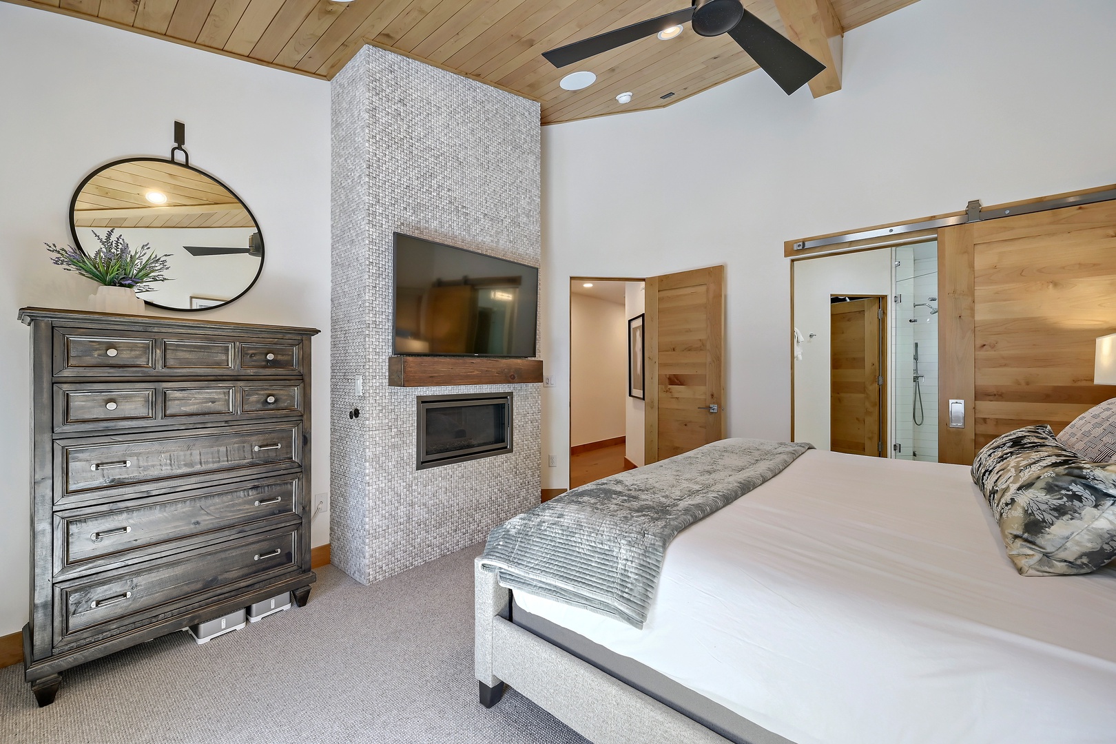 Unwind in your spacious suite with a cozy fireplace, elegant wood accents, and a luxurious ensuite bathroom for ultimate relaxation.