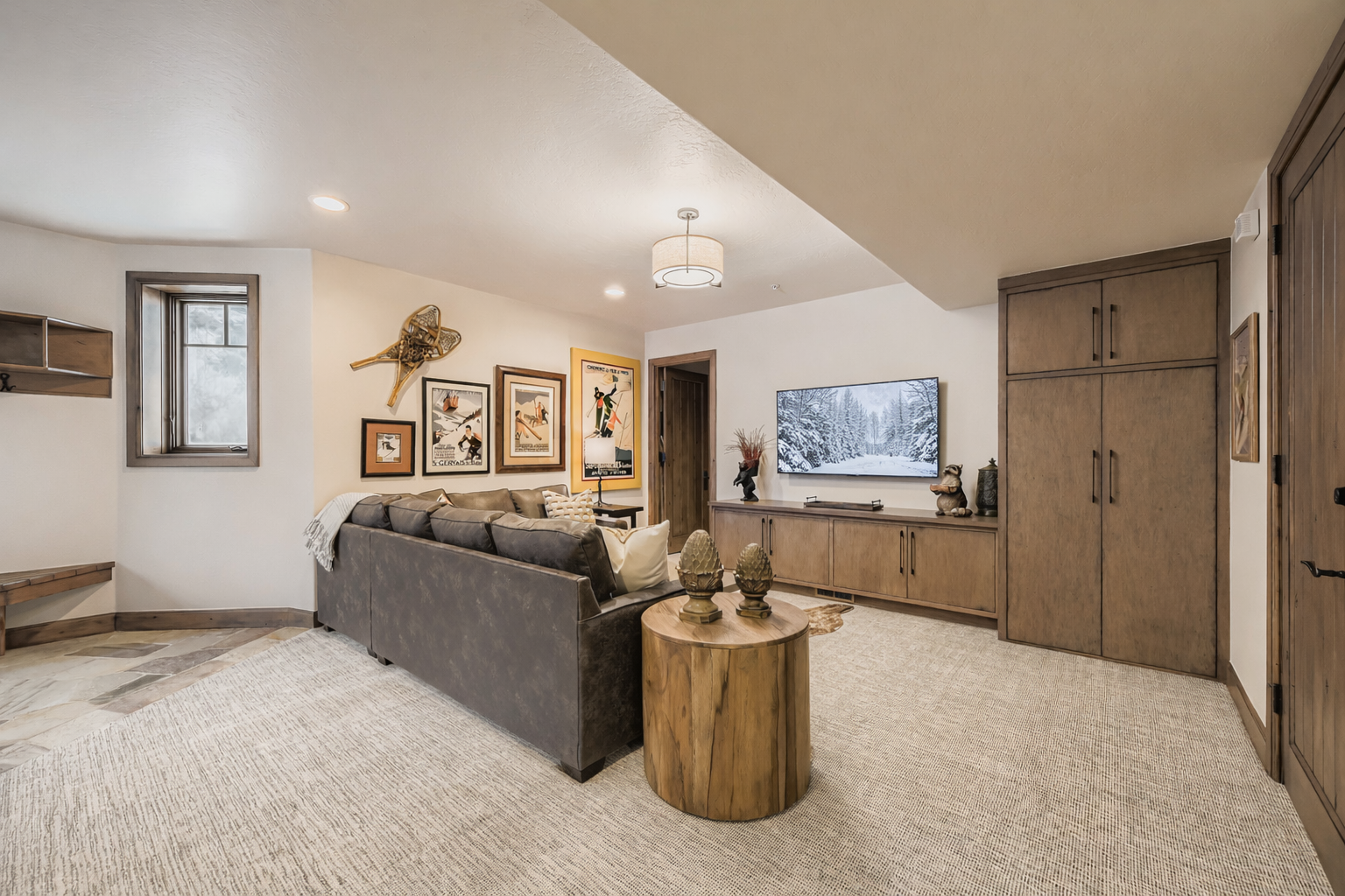 Relax in your stylish living room featuring a cozy sectional sofa, rustic wood accents, and curated artwork that creates the perfect atmosphere for unwinding.