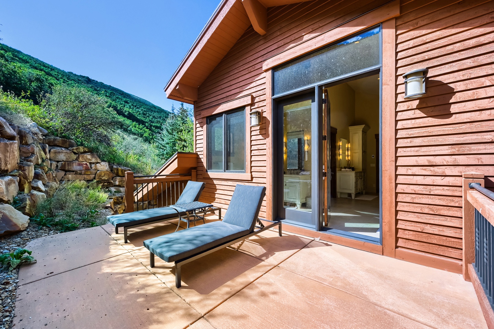 Beautiful Deck with Sunbathing Lounging Chairs. Nice place to sit, read or just enjoy the Natural Landscape