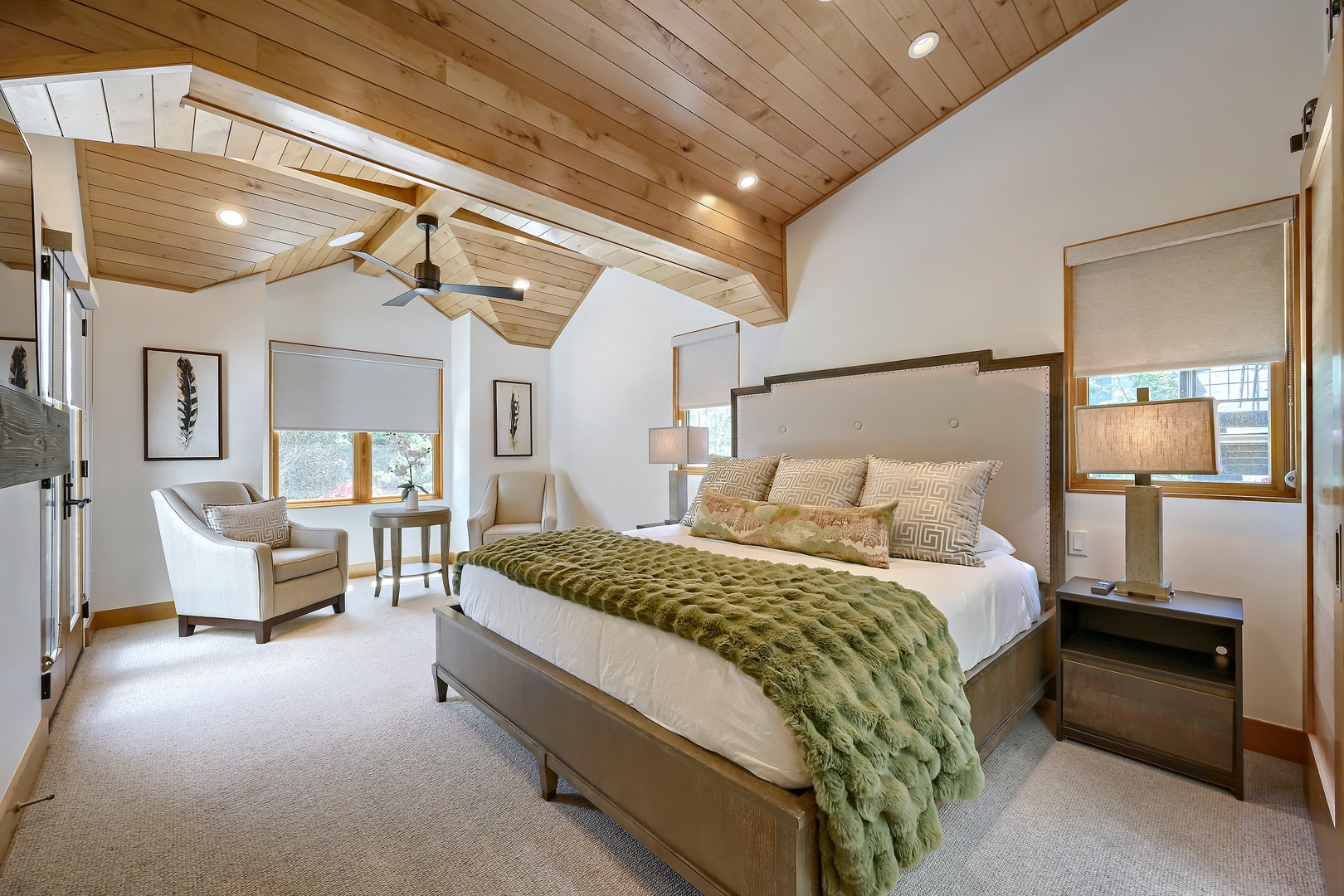 Step into your serene retreat where vaulted wood ceilings and soft natural light create the perfect setting for restful nights and peaceful mornings in this thoughtfully designed bedroom.