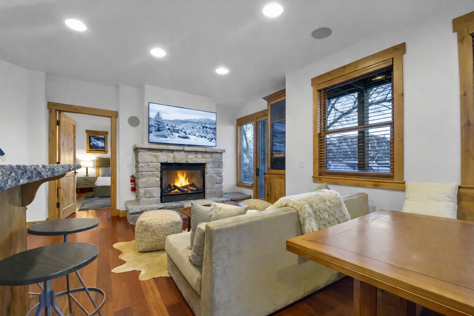 Cozy up in your mountain retreat with crackling fireplace and plush seating, perfect for après-ski relaxation. Unit B