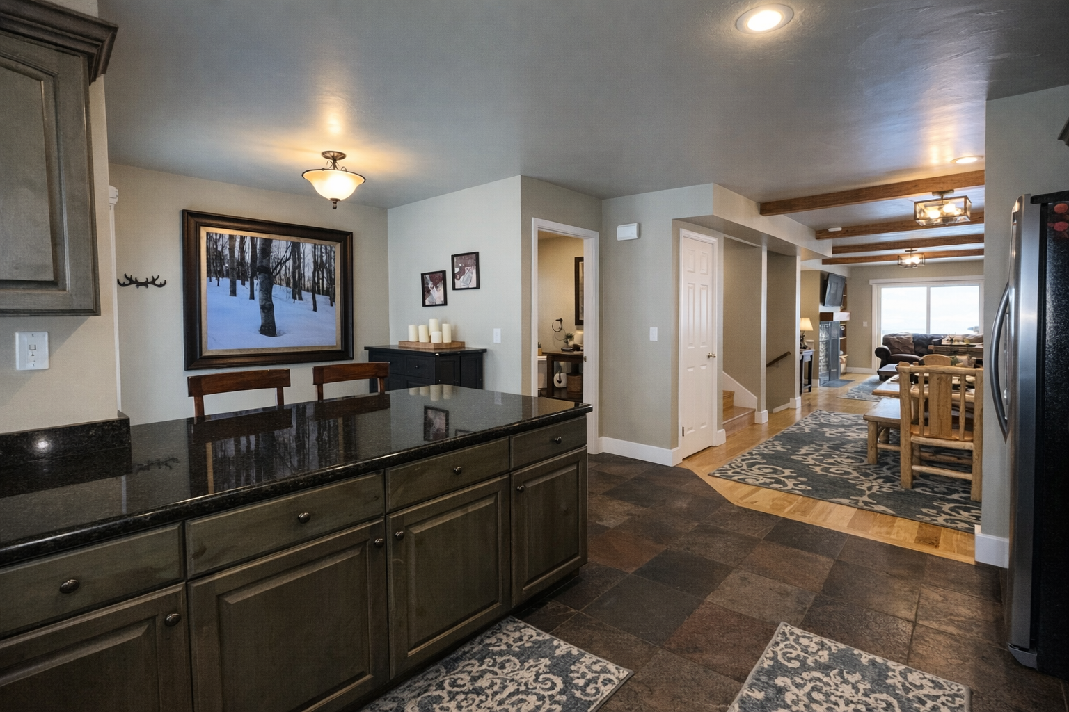 You'll love creating meals in this spacious kitchen featuring granite counters, quality appliances, and an open flow to the cozy living area.