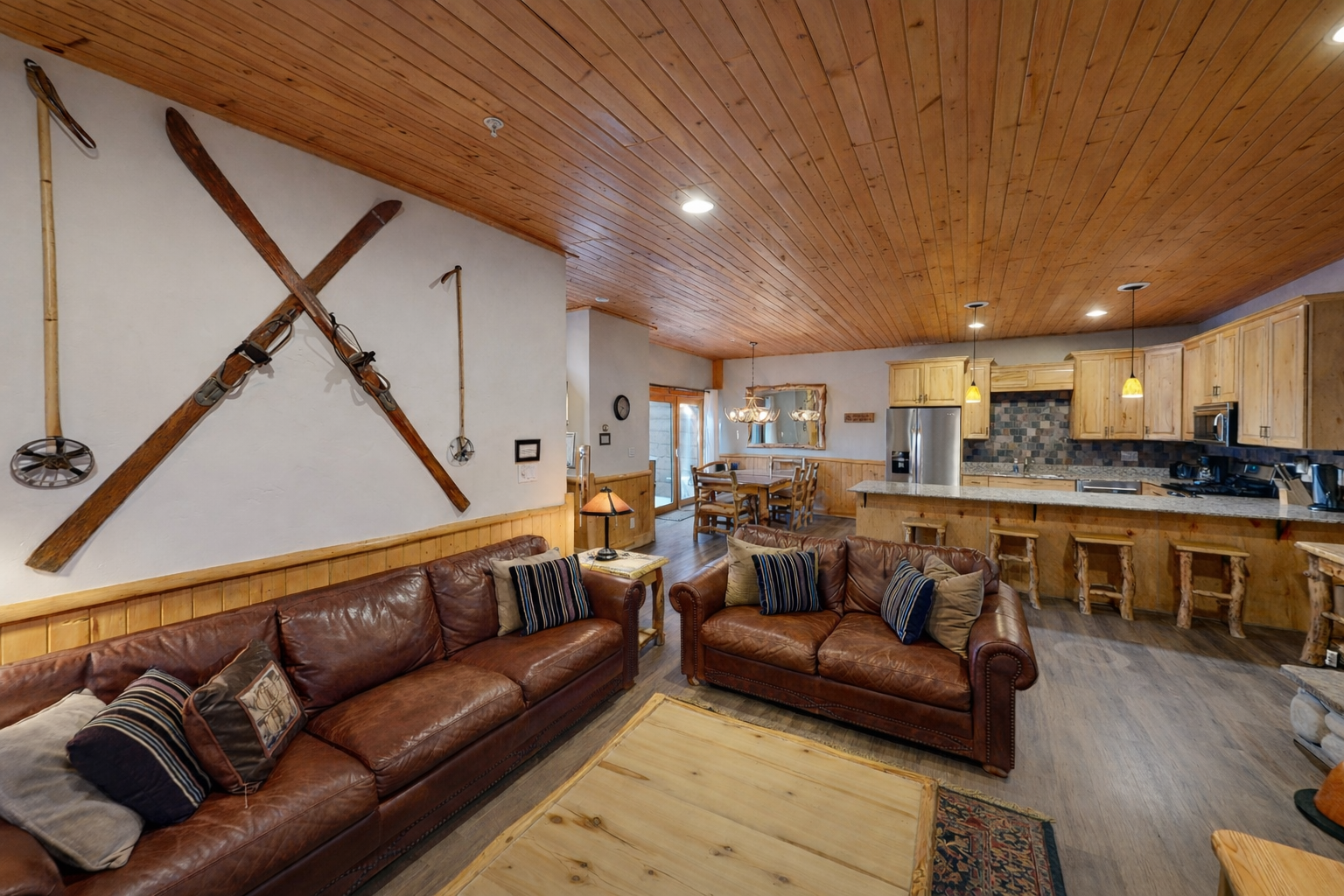 Cozy up in your rustic mountain retreat with rich leather sofas and a gourmet kitchen perfect for après-ski gatherings.