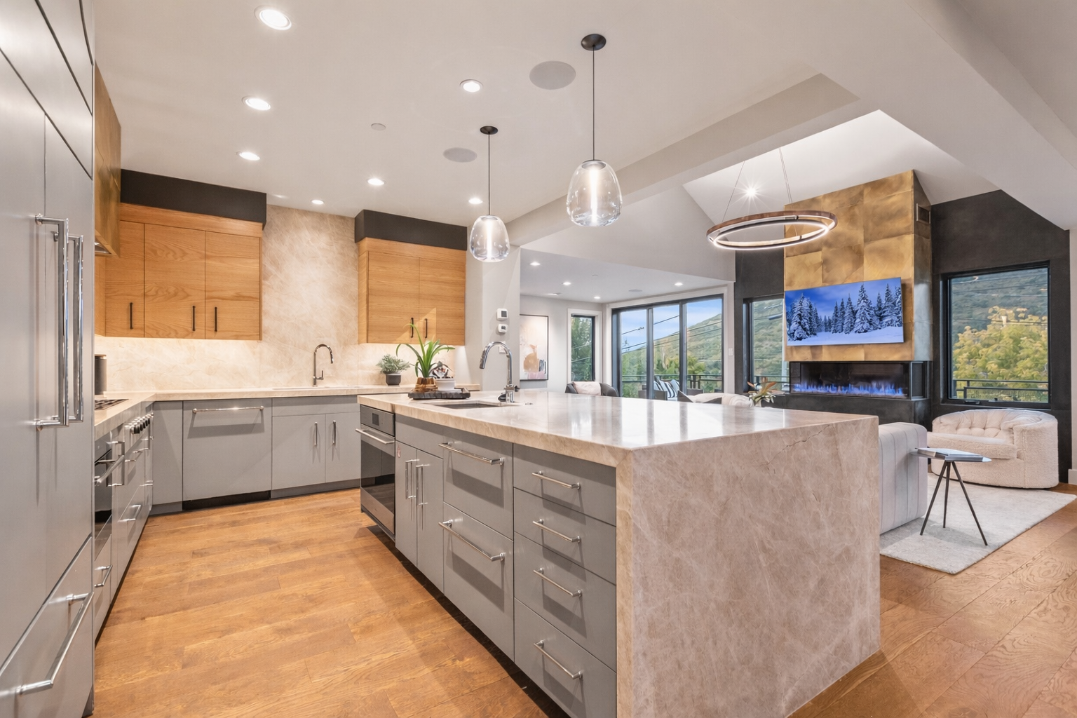Whip up a gourmet meal in this fully-equipped kitchen featuring a large island, granite countertops, and bar seating.