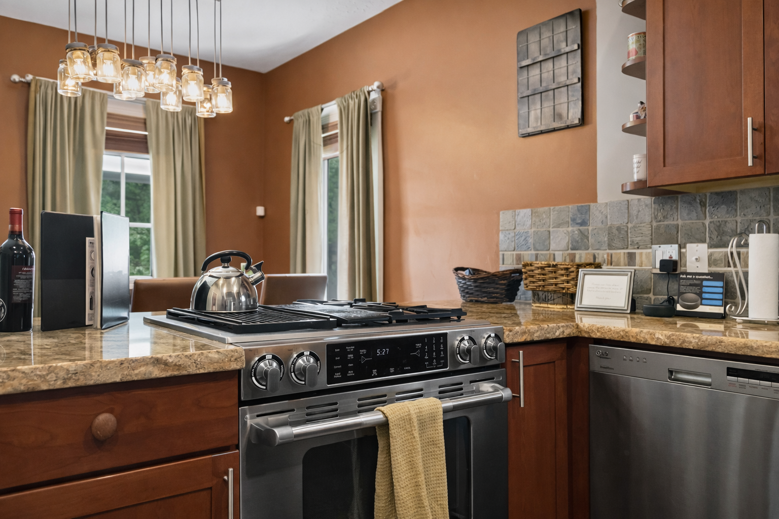 Your gourmet kitchen features granite counters, stainless appliances, and warm pendant lighting for memorable meal prep moments.