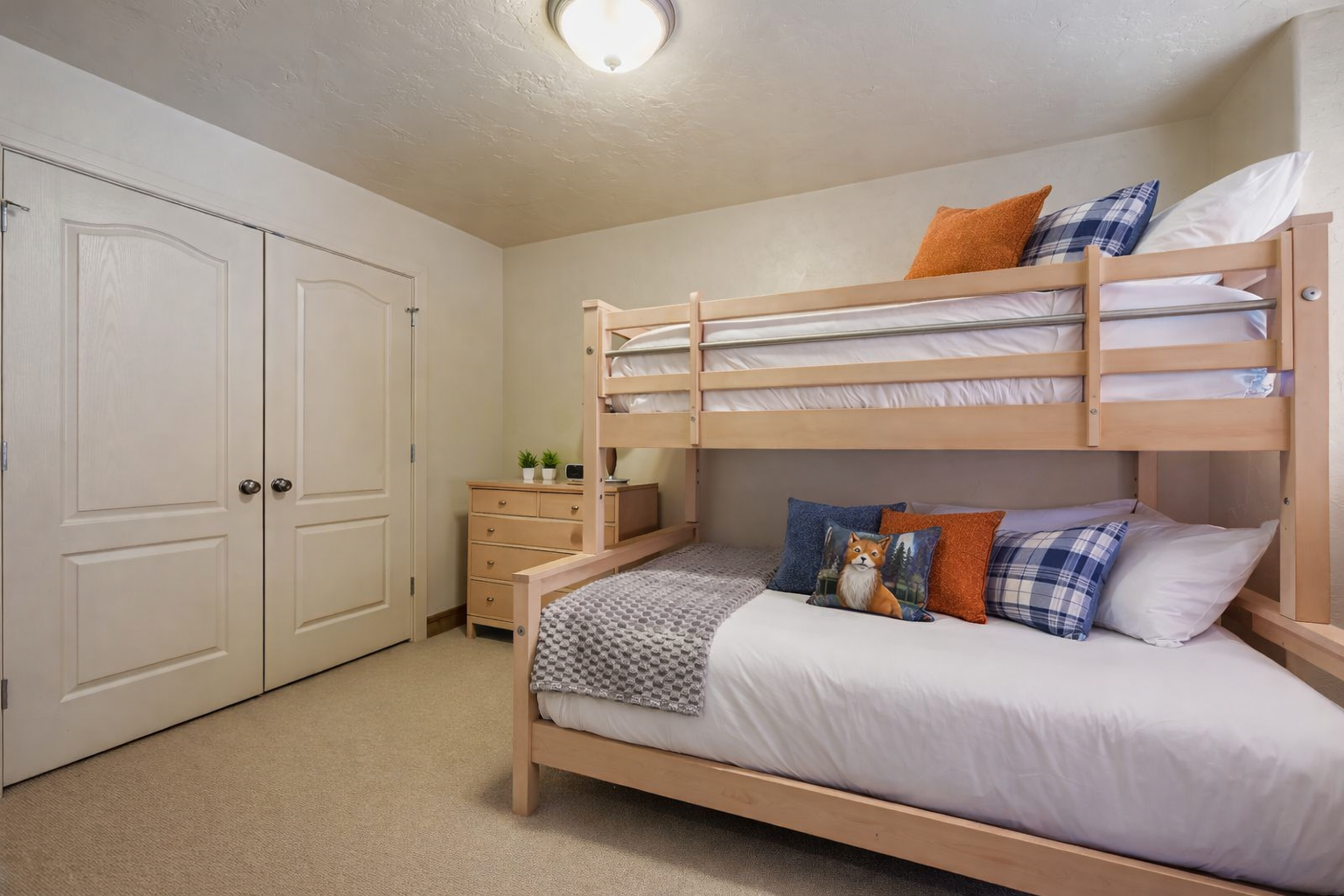 Your comfortable bunk bed room features space-saving design with cozy bedding, ample storage, and a warm, welcoming atmosphere perfect for families or groups.