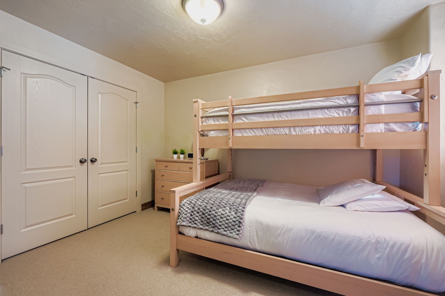 Your comfortable bunk bed room features space-saving design with cozy bedding, ample storage, and a warm, welcoming atmosphere perfect for families or groups.