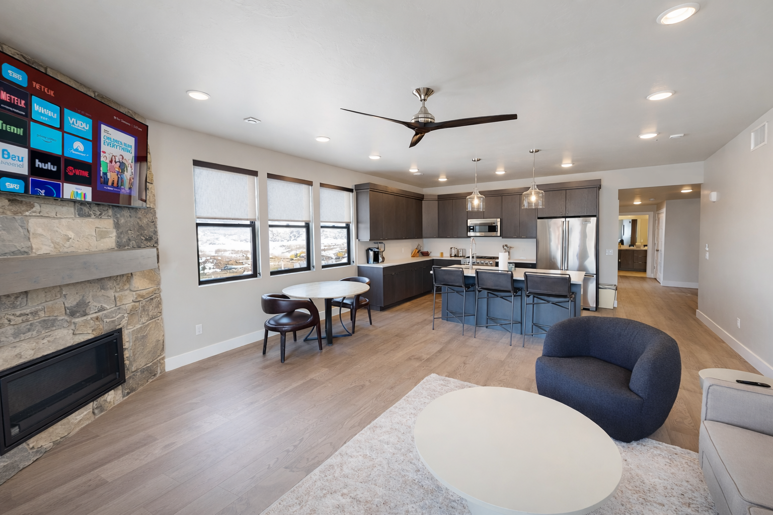 Experience bright, open-concept living in this modern space. Features include a gourmet kitchen with a large island, cozy dining area, and sun-drenched windows—perfect for a stylish group getaway.