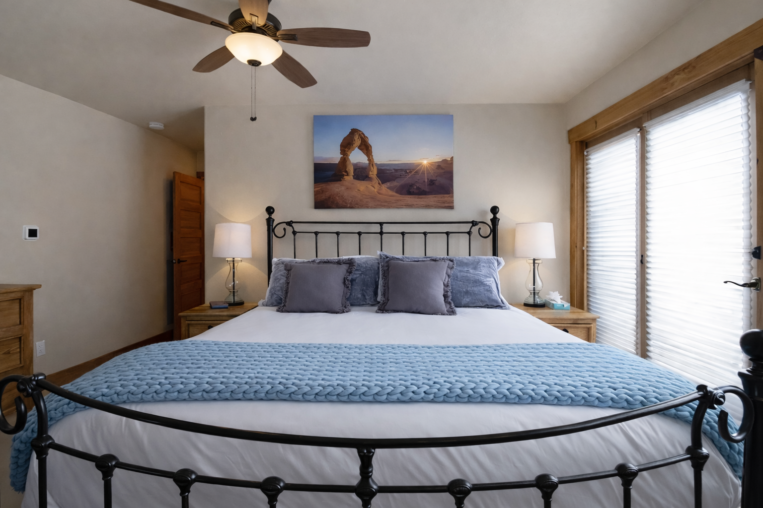 Cozy mountain retreat with a plush king bed and TV. Step onto the private deck with forest views.