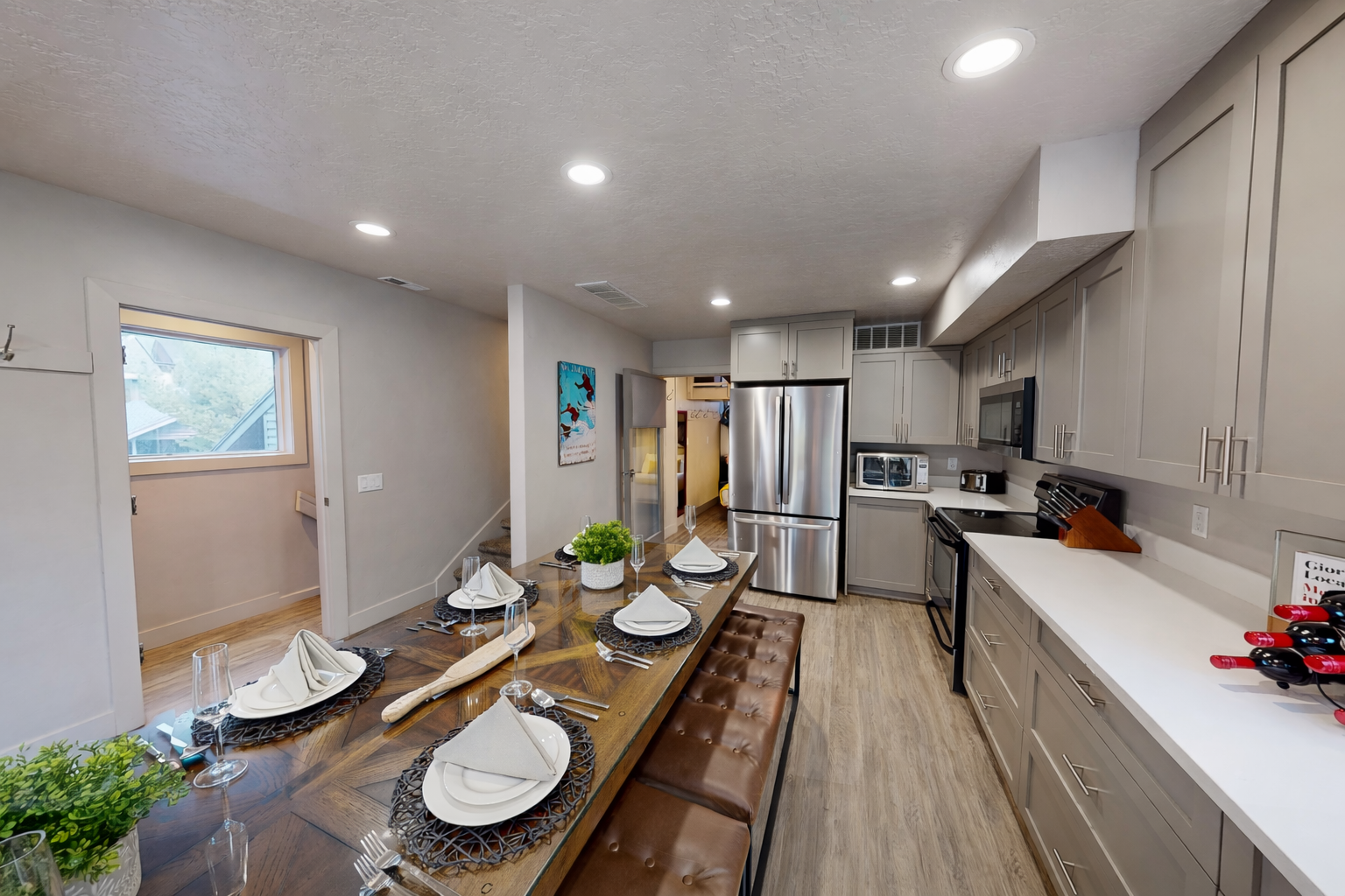 Your spacious kitchen and dining area features modern appliances, elegant table settings, and an open layout perfect for memorable meals together.