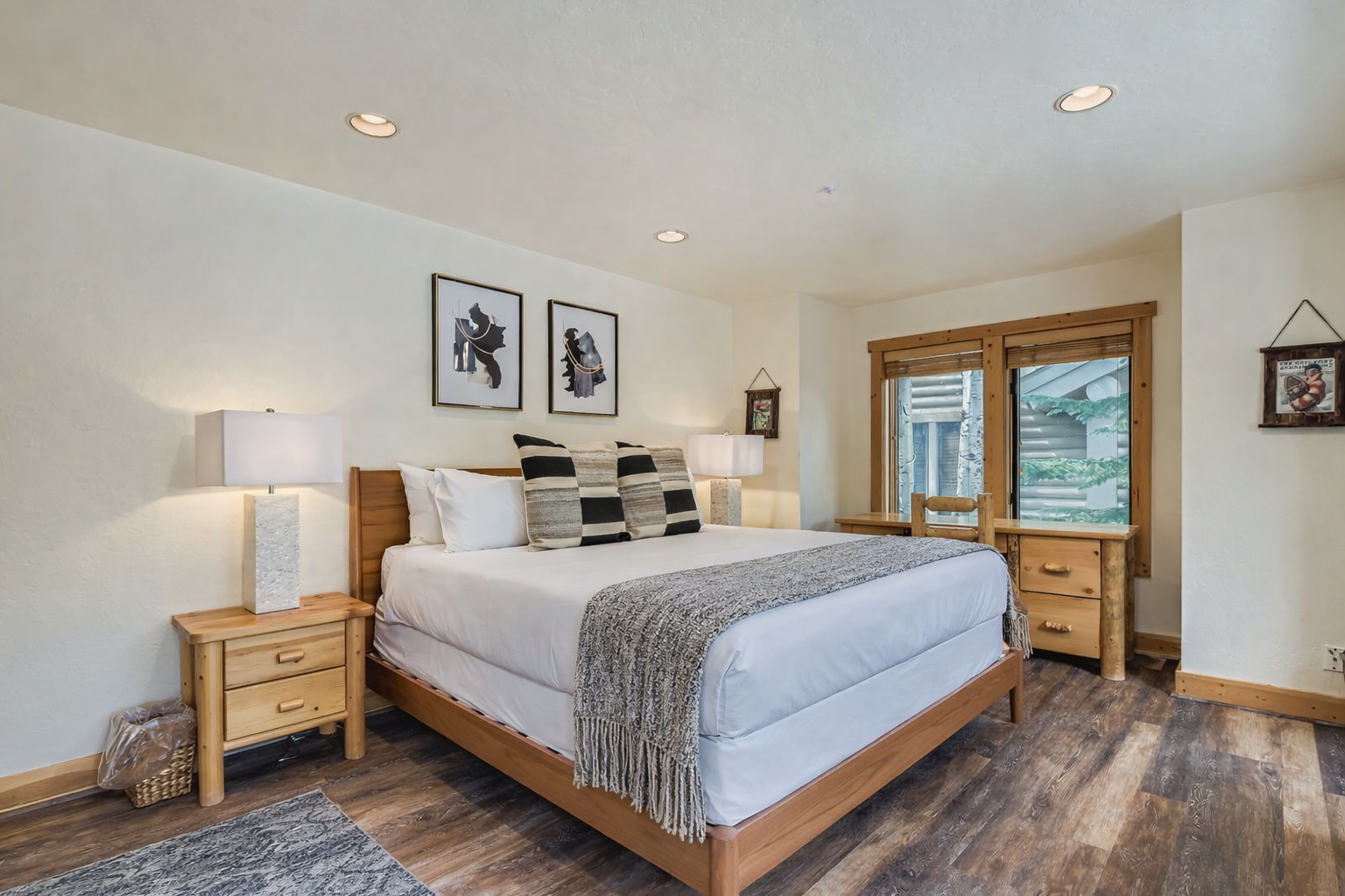 Unwind in your serene bedroom featuring crisp linens, warm wood accents, and thoughtful touches that invite restful nights.