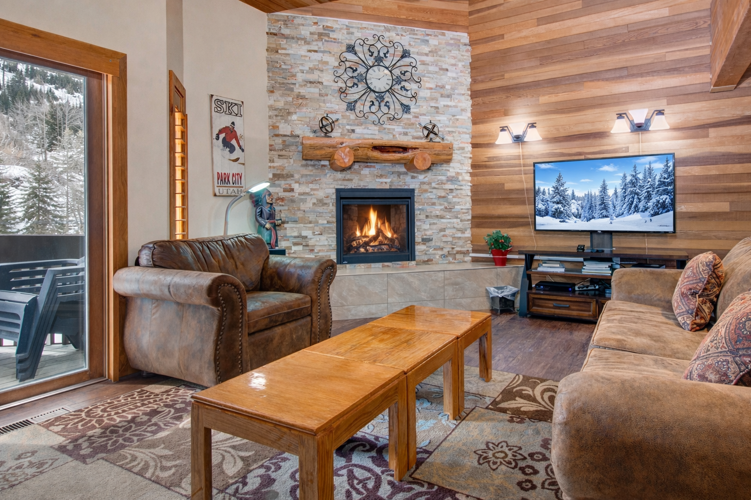 Curl up in plush leather seating by the crackling fireplace while snow-capped peaks fill your window view.