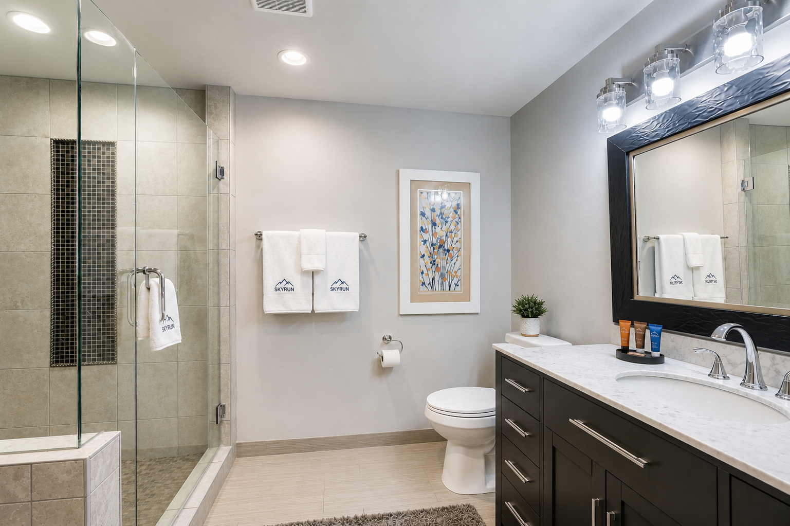 Refresh in your spacious private bathroom with walk-in shower, soaking tub, and bright vanity lighting—everything you need for a relaxing morning or evening.