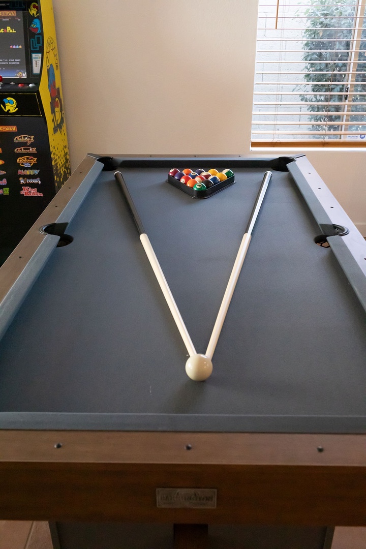 Challenge your companions to a game on this professional billiard table, complete with colorful balls ready for your next competitive match.