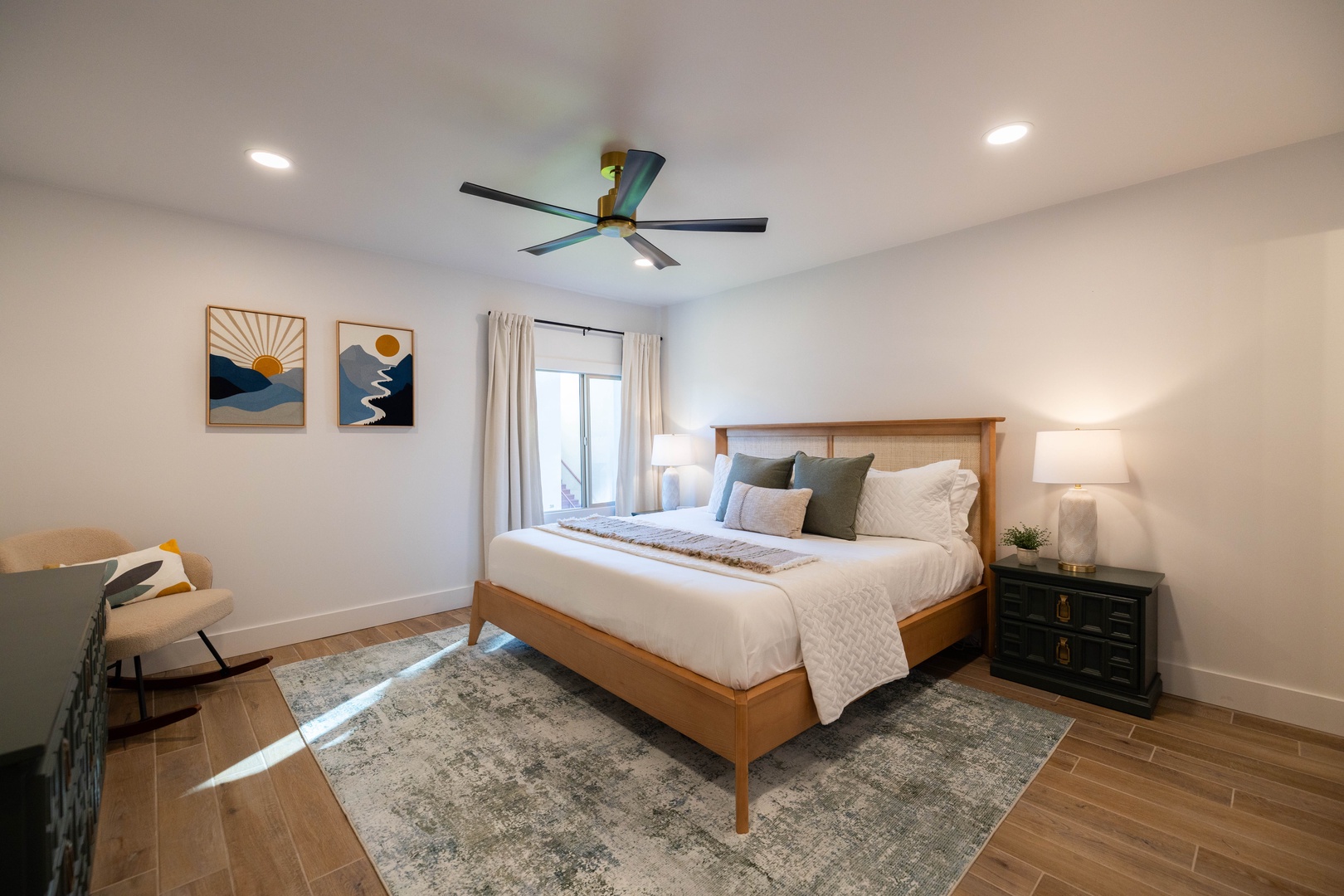 Your master bedroom sanctuary features crisp linens, warm wood furnishings, and en-suite bath creating the perfect retreat for restful nights.