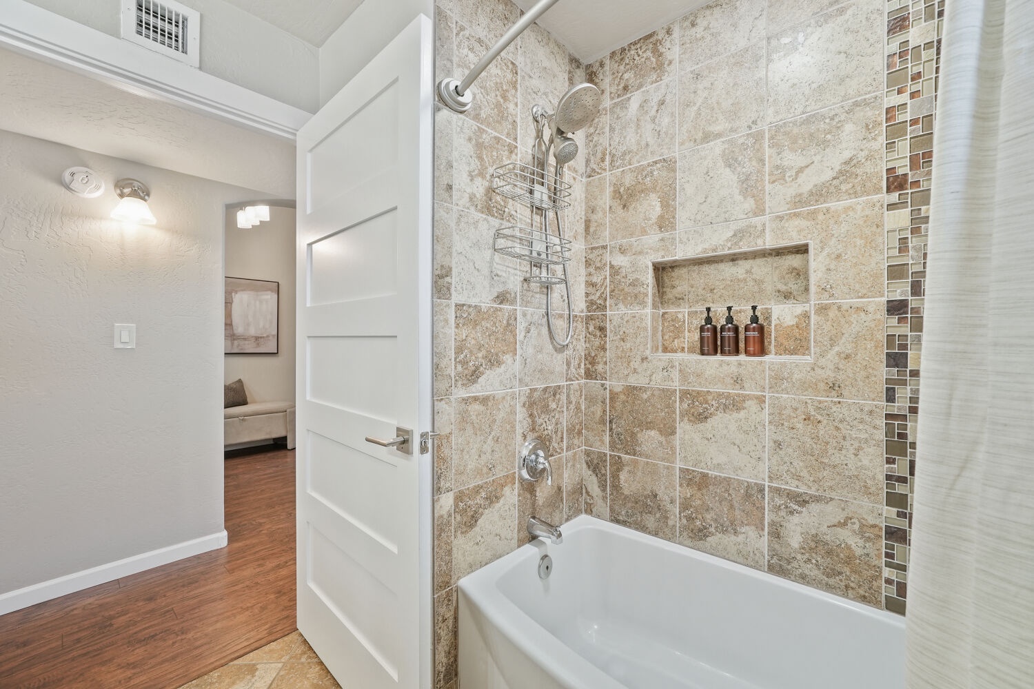 Hallway full bathroom with tub and shower combo