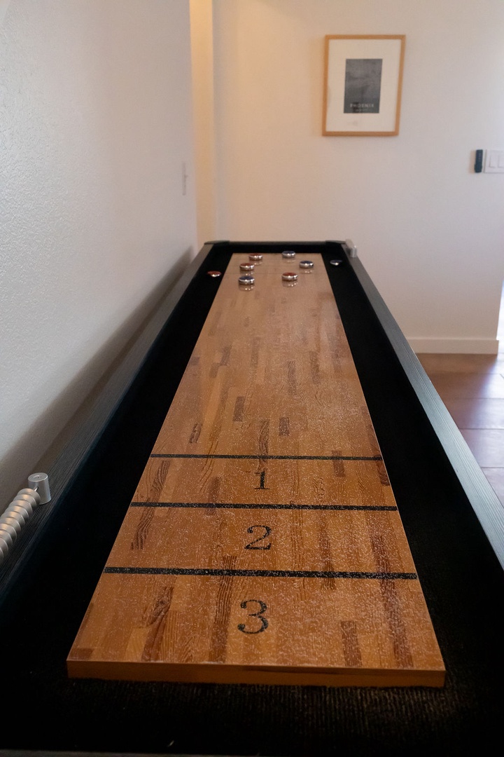 Challenge your friends to a classic game of shuffleboard in your own private game room, complete with scoring zones and metal pucks.