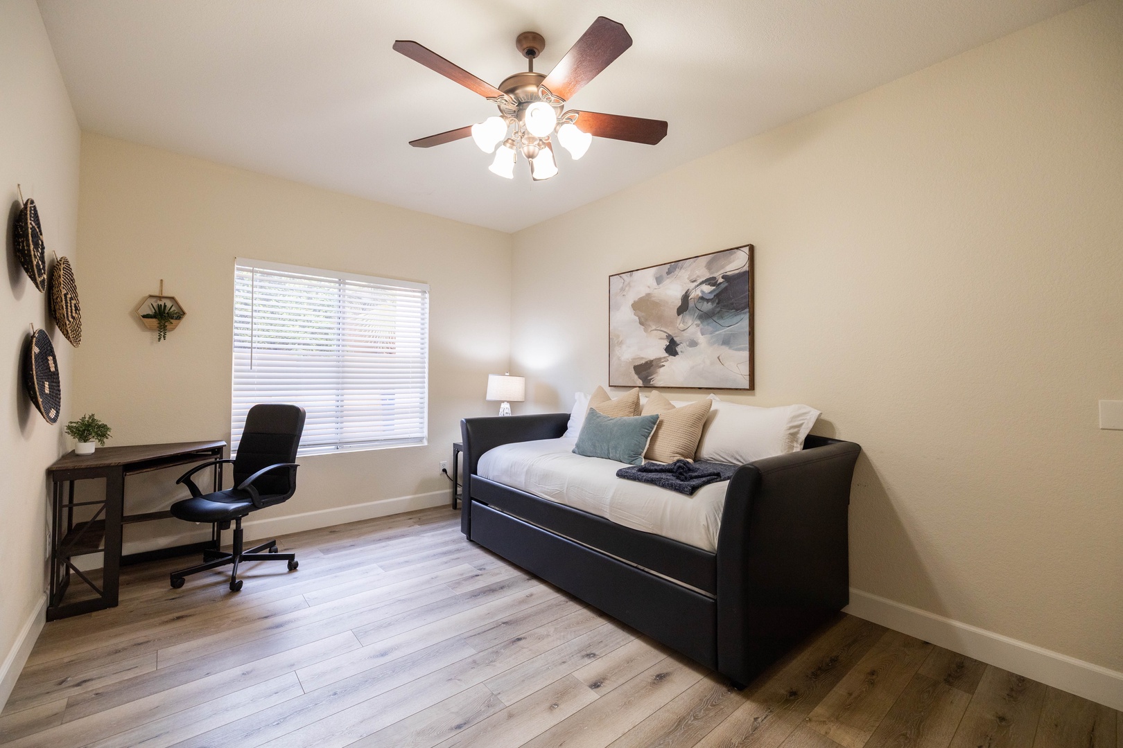 Ground Floor bedroom with versatile daybed and trundle, transforms this bright room into a perfect workspace or extra sleeping area.