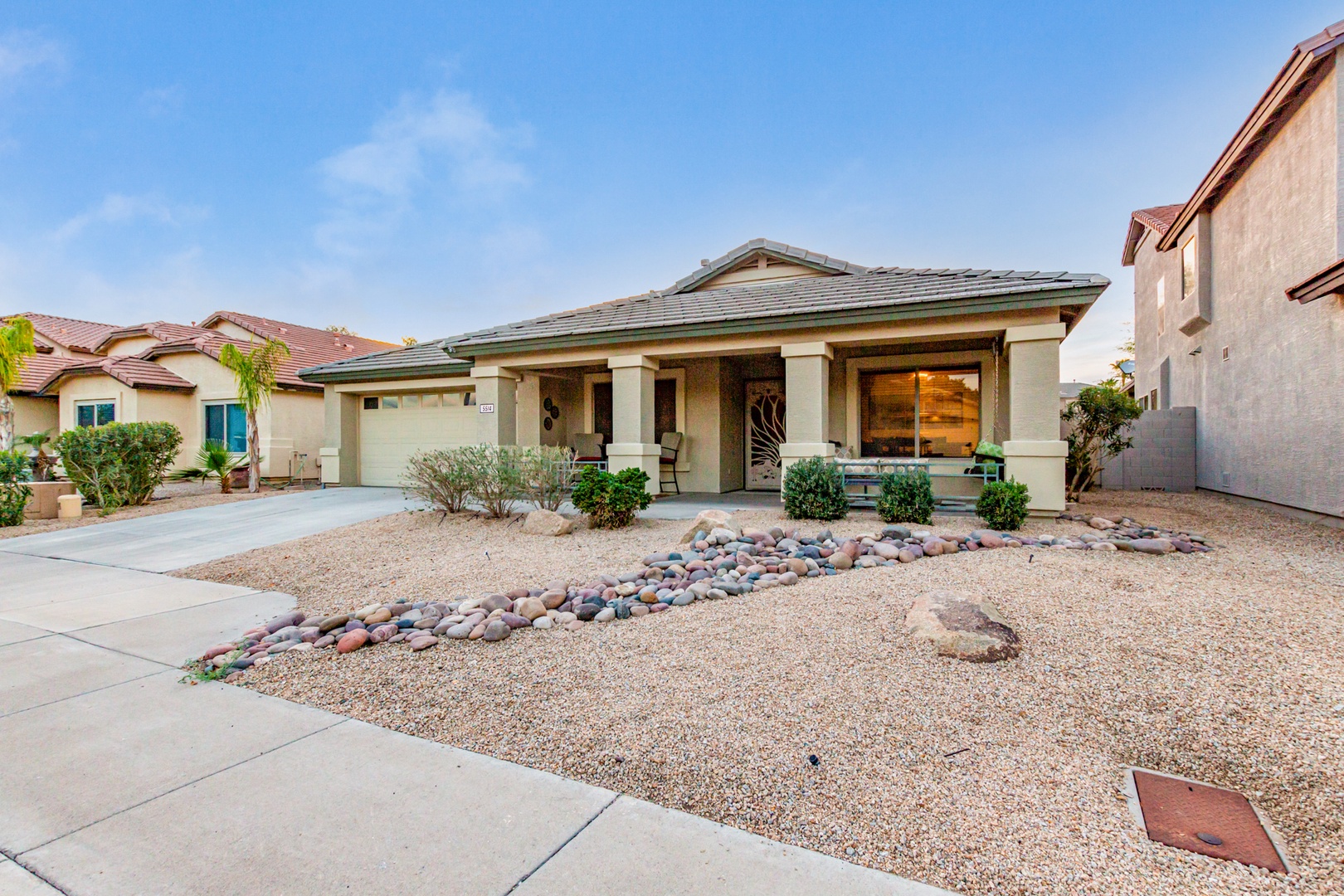 Desert modern home with decorative stone landscaping