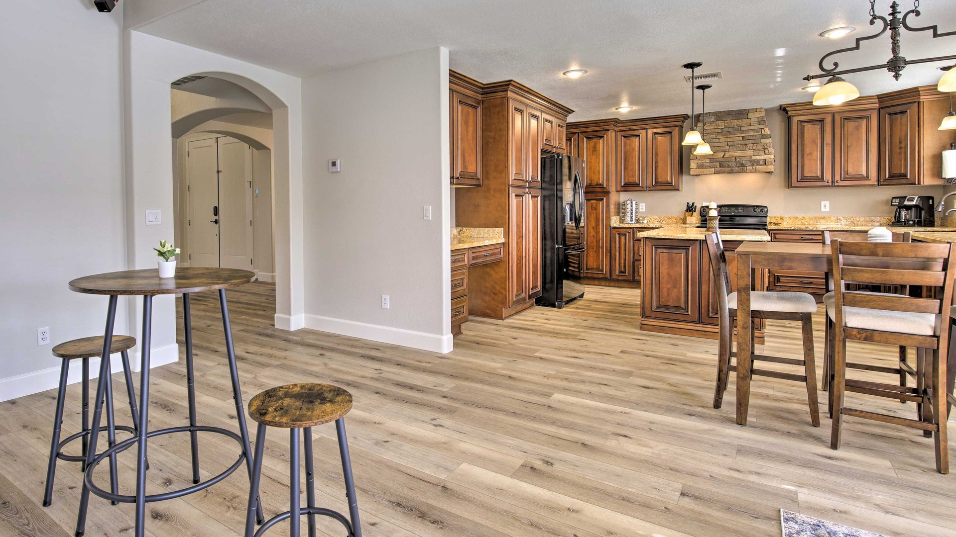 Your spacious kitchen welcomes you with rich wood cabinets