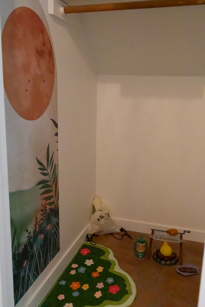 Your little ones will love their own magical hideaway beneath the stairs, complete with jungle murals and cozy play space.