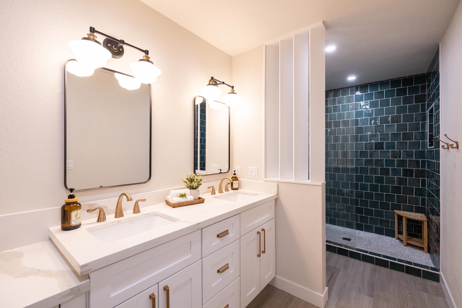 Double vanity + emerald walk-in shower — luxury in every detail