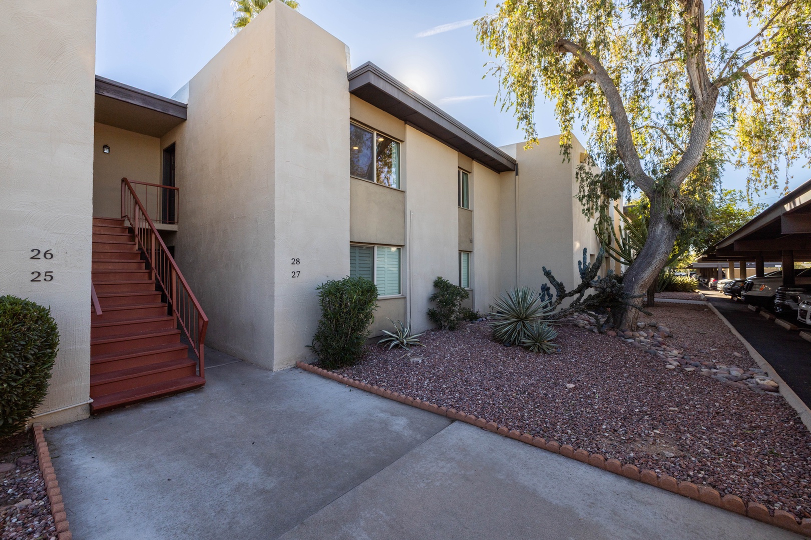 Condominium entrance is just up the stairs from the parking lot and to the right.