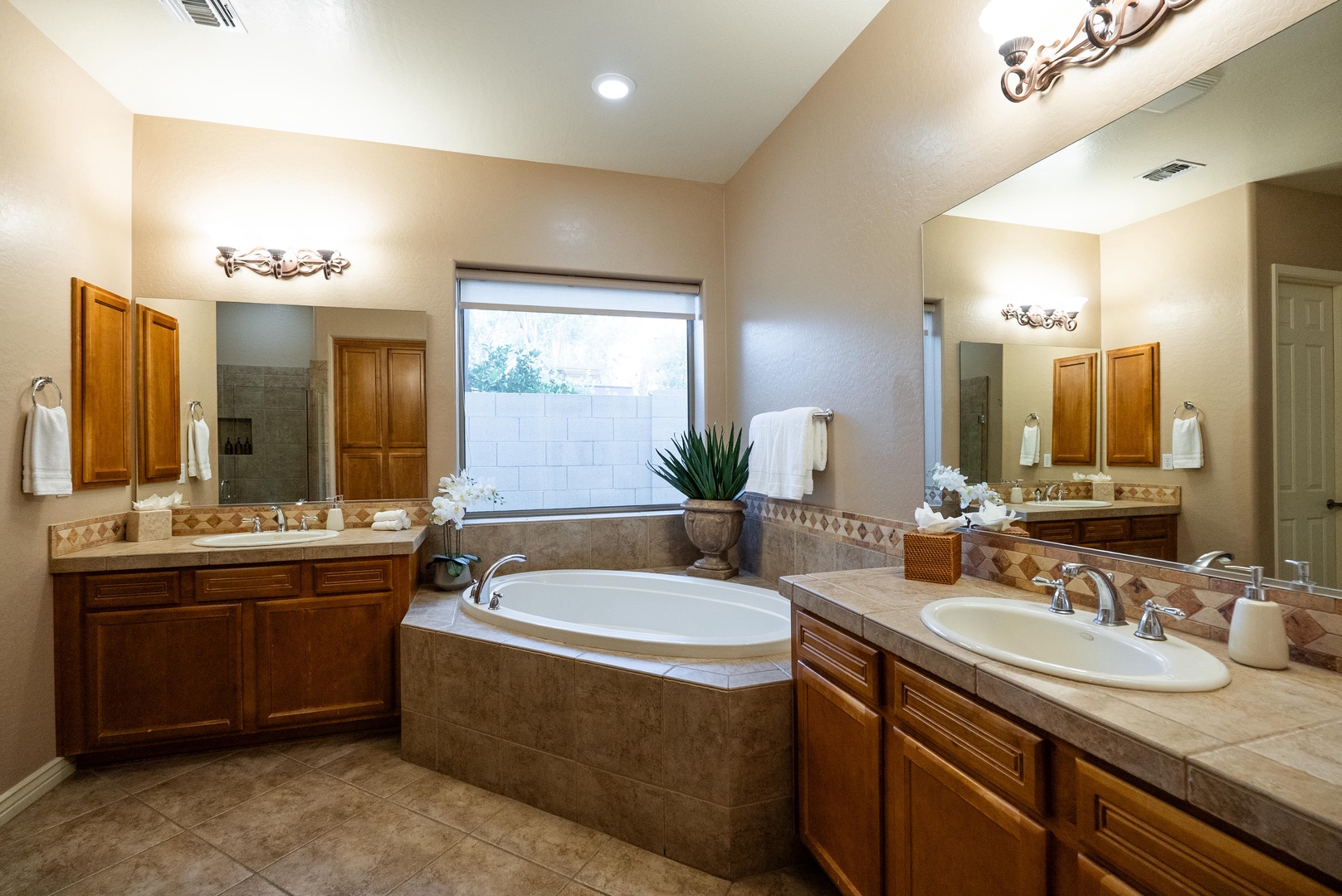 A master bath retreat with soak-in tub, double sinks and shower