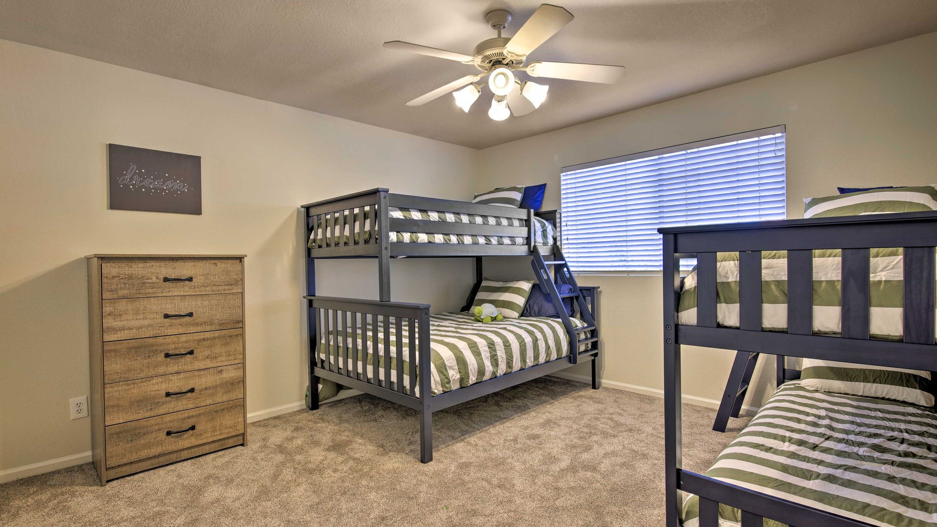Your kids will love this spacious bunk room with 4 comfortable beds. Three twins and one double. Can sleep up to 5