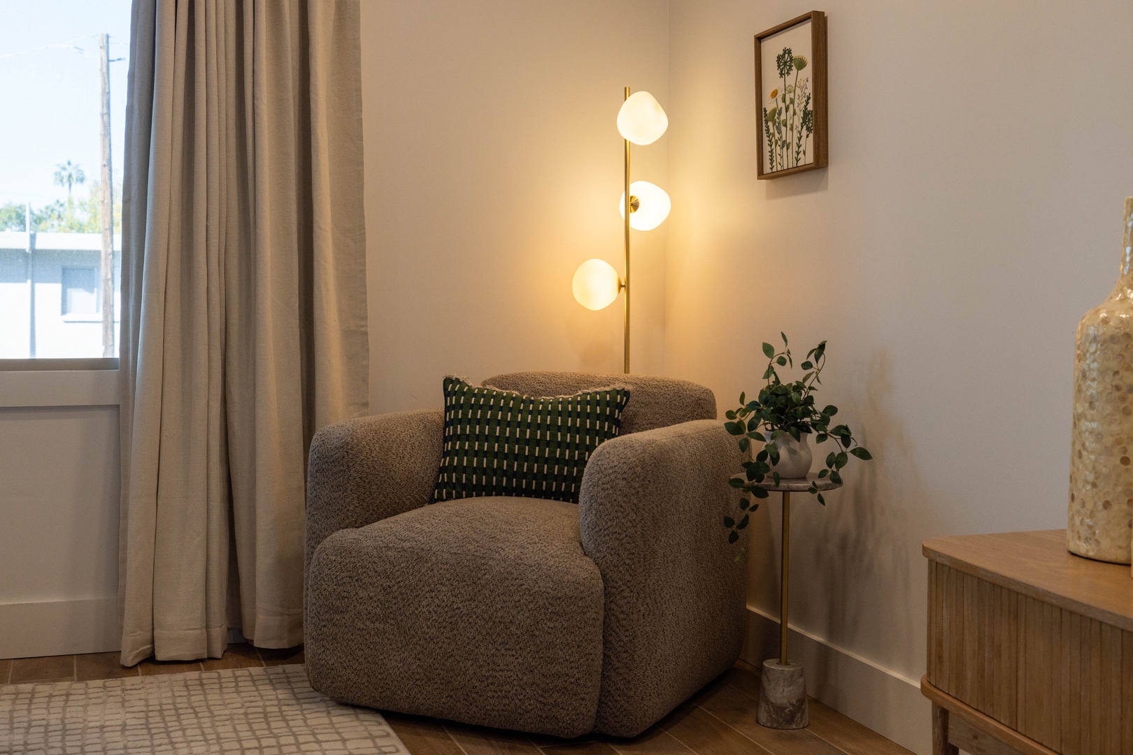 Sink into your cozy reading nook with soft ambient lighting and a perfect spot to unwind after exploring the city.