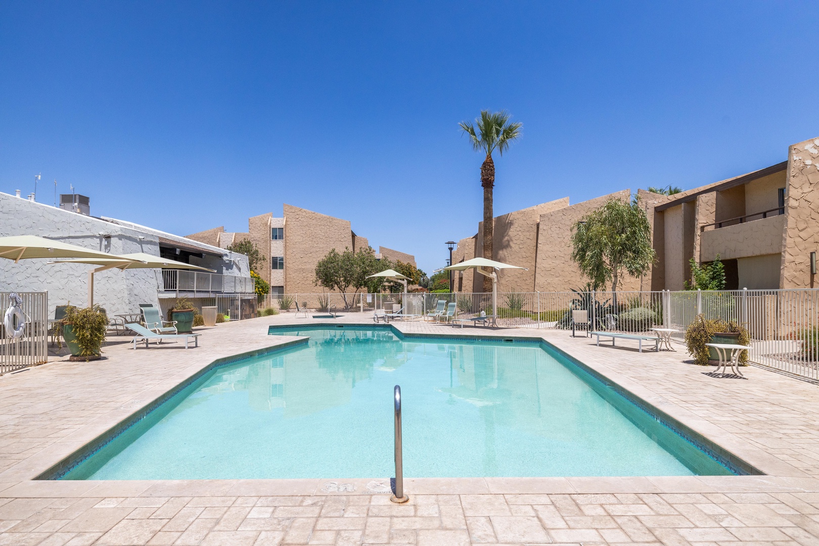 Heated pool, blue skies, and vacation mode activated.