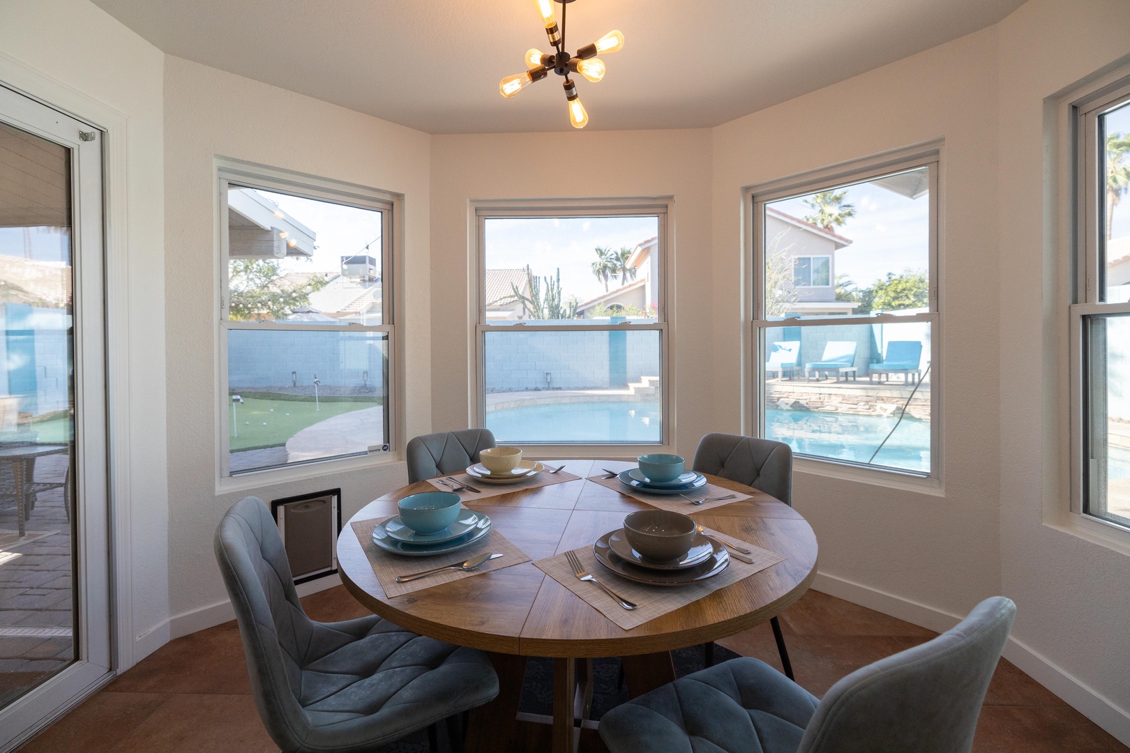Gather around this inviting dining nook where morning coffee