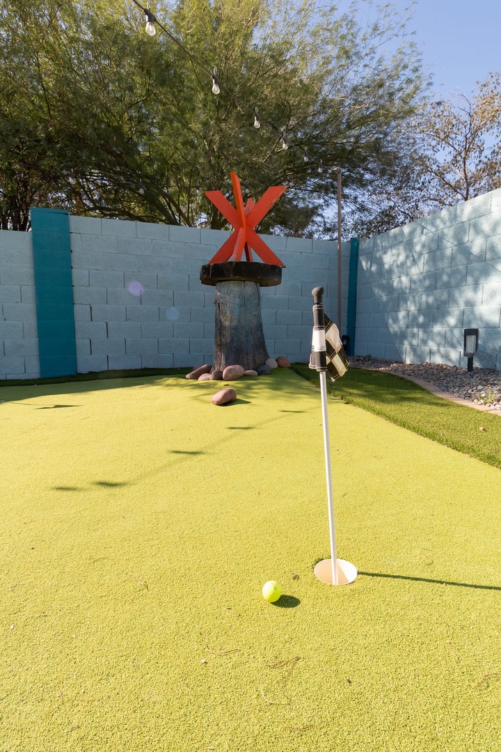 Practice your putting skills on this fun backyard mini golf course, complete with creative obstacles and beautiful desert landscaping.