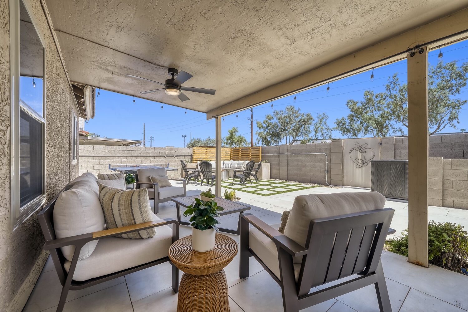 Step into your covered patio where relaxation comes naturally.