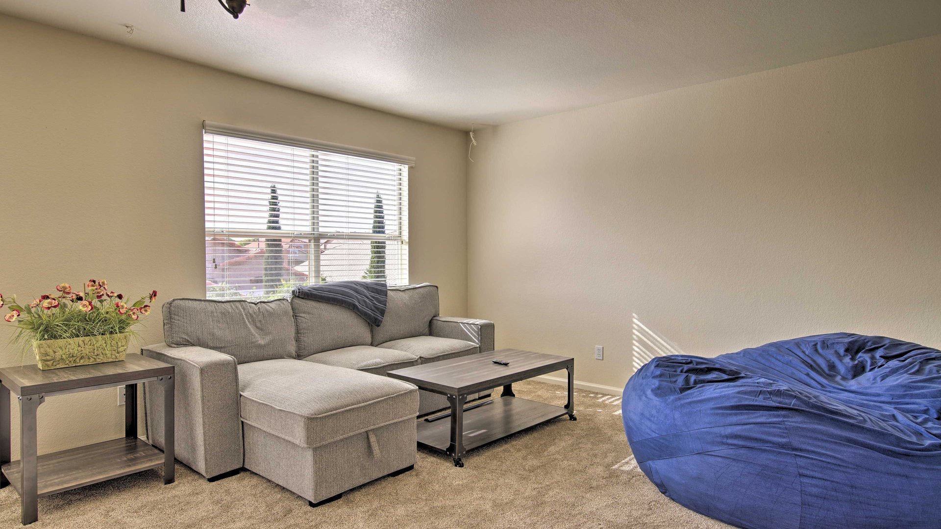 Unwind in your upstairs spacious living room with plush sectional seating
