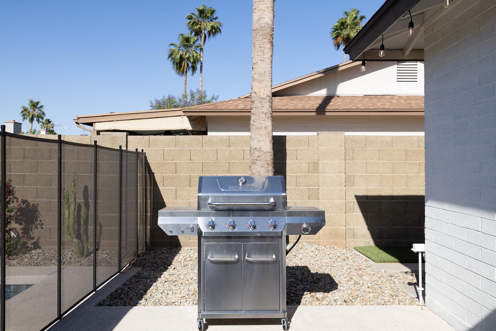4-burner stainless grill ready for your Scottsdale BBQ night