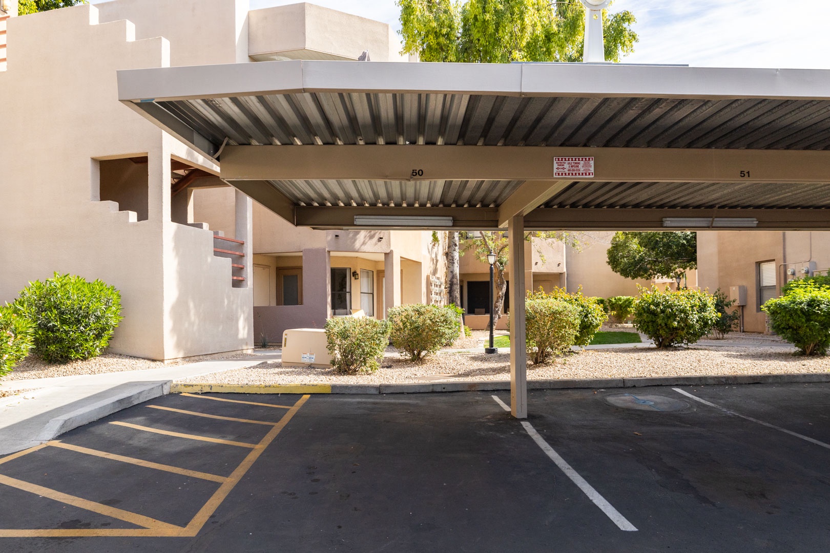 Modern property exterior with covered parking