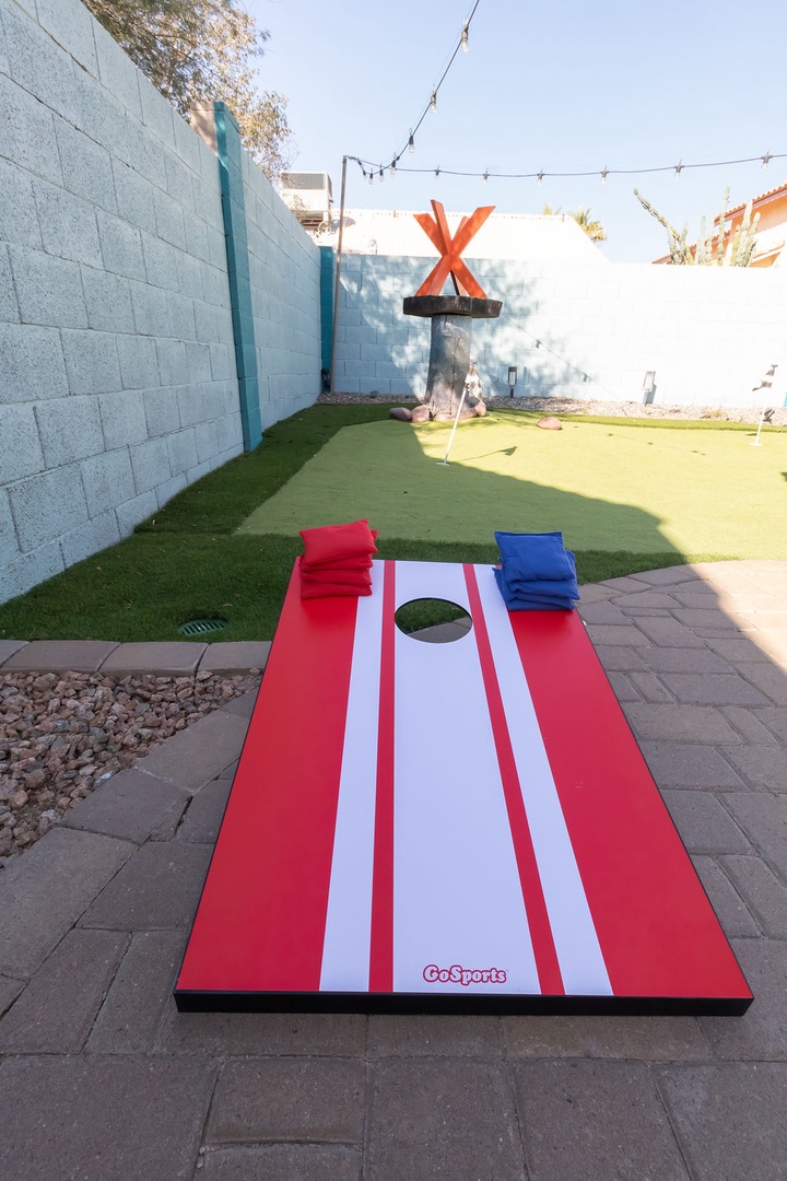 Challenge friends to cornhole in your private outdoor oasis, complete with artificial turf putting green and festive string lights overhead.
