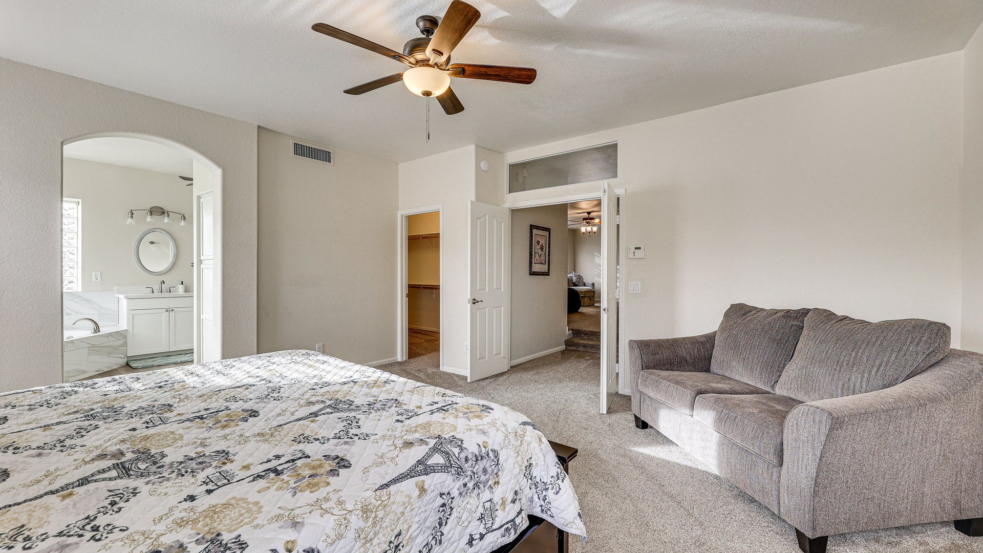 Rest in your spacious bedroom with cozy sofa and ensuite bathroom