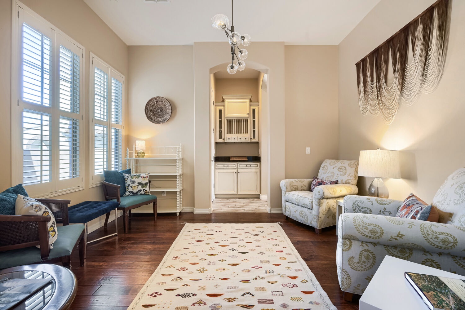 Unwind in your elegant living room, where vaulted ceilings and soft natural light create a warm, open ambiance perfect for relaxing after a day of adventure.
