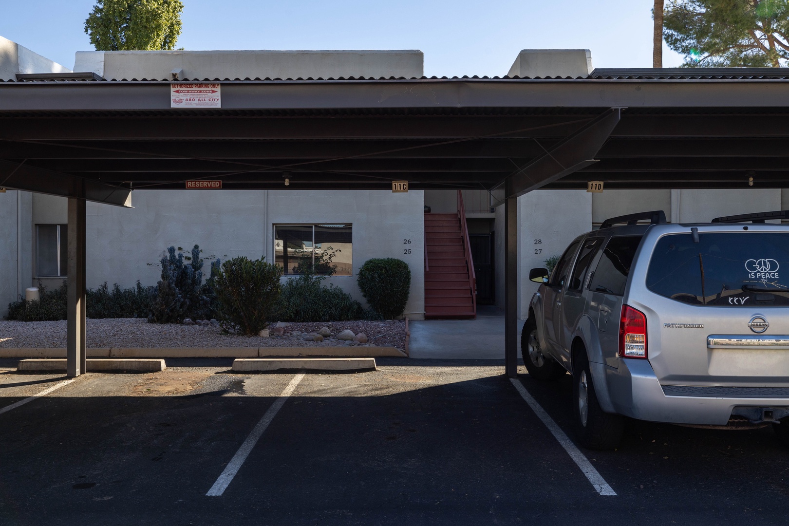 Covered parking space directly below condo entrance.