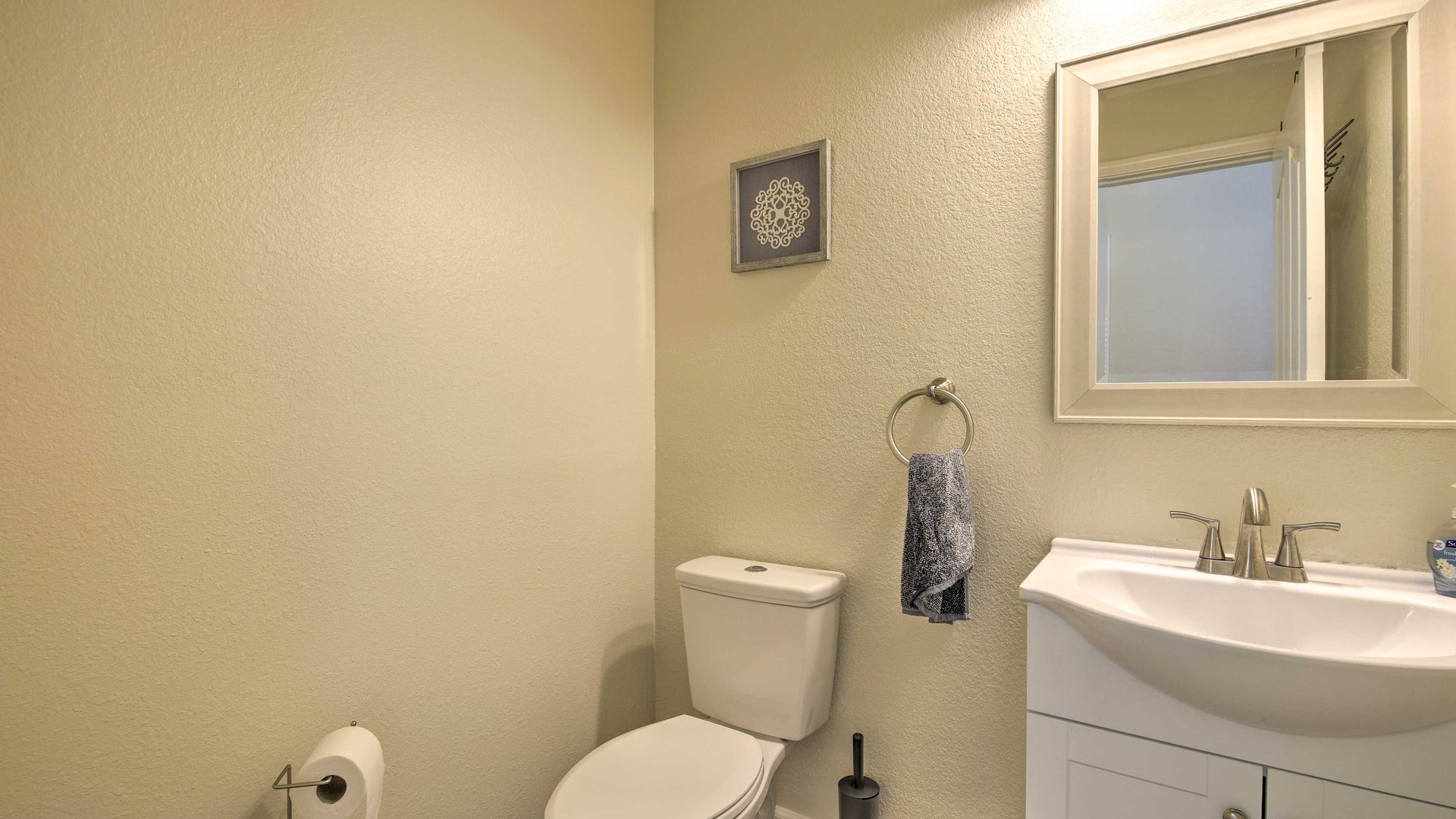Step into your private powder room on the main level. This is just a half bathroom