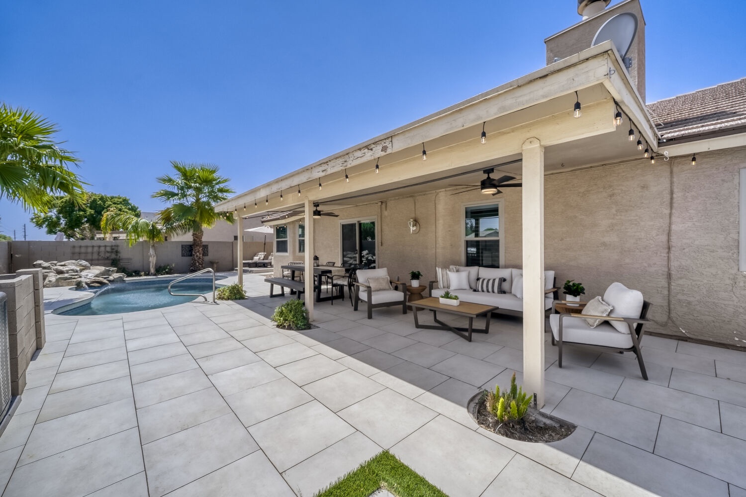 Relax in our backyard, overlooking the heated pool