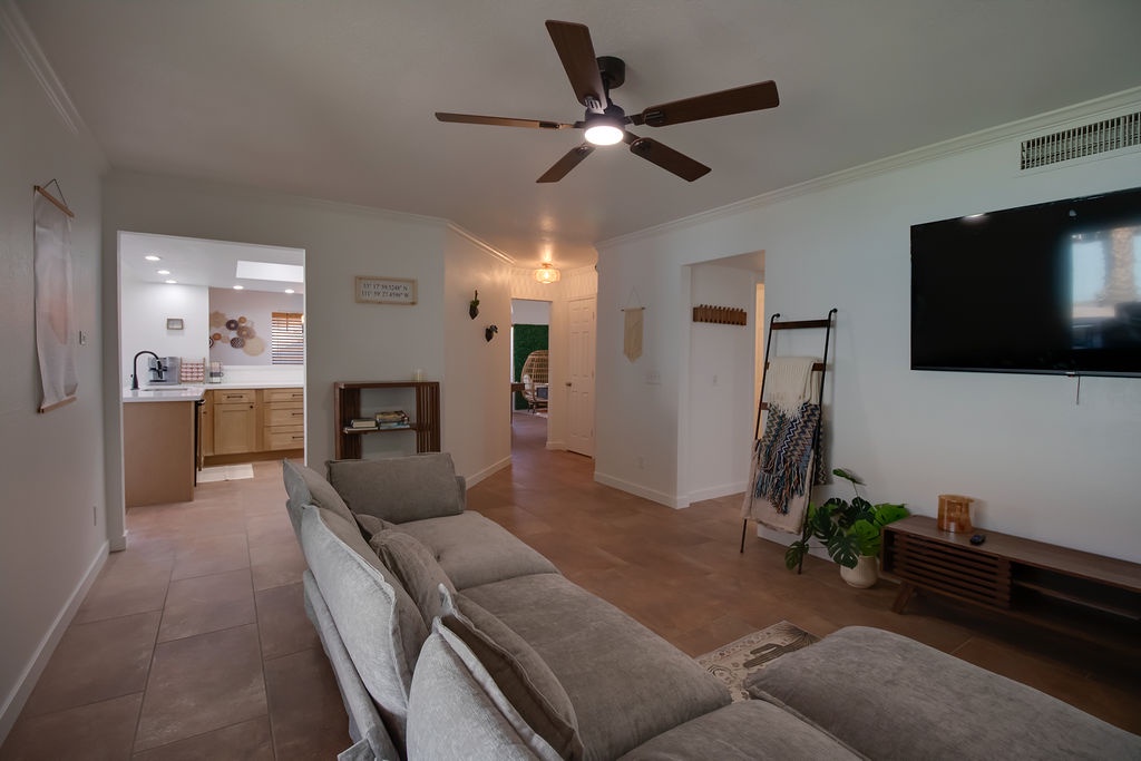 Sink into the plush sectional and enjoy your favorite shows on the large TV in this bright, airy living space.